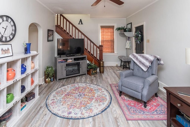124 Clarendon Ave, South Union Twp, PA 15401 - living room with wood finished floors, stairway, ceiling fan, crown molding, and arched walkways
