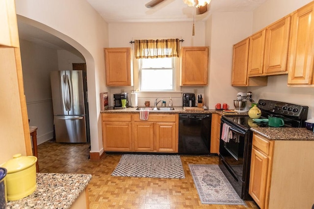 124 Clarendon Ave, South Union Twp, PA 15401 - kitchen with black appliances, a sink, arched walkways, ceiling fan, and light flooring