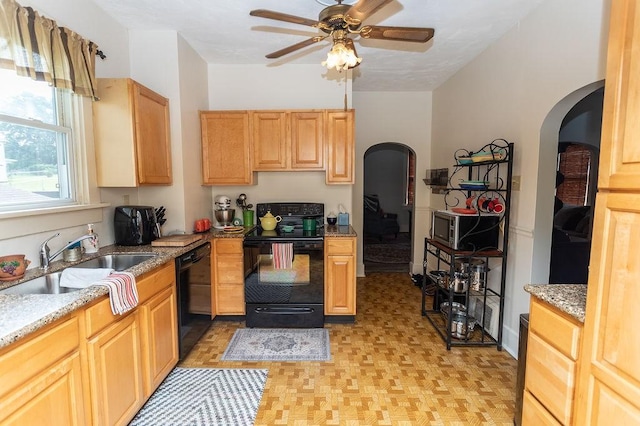 124 Clarendon Ave, South Union Twp, PA 15401 - kitchen featuring black appliances, arched walkways, a sink, a ceiling fan, and light stone countertops