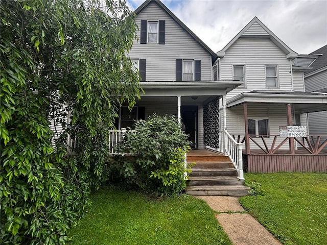 135 Hamilton Ave, Vandergrift Wml, PA 15690 - view of front of house featuring a porch and a front yard