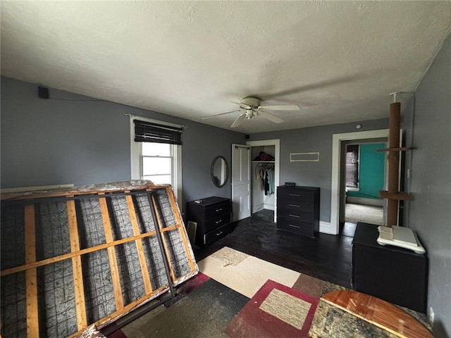 135 Hamilton Ave, Vandergrift Wml, PA 15690 - bedroom featuring a closet, a ceiling fan, a textured ceiling, baseboards, and wood finished floors
