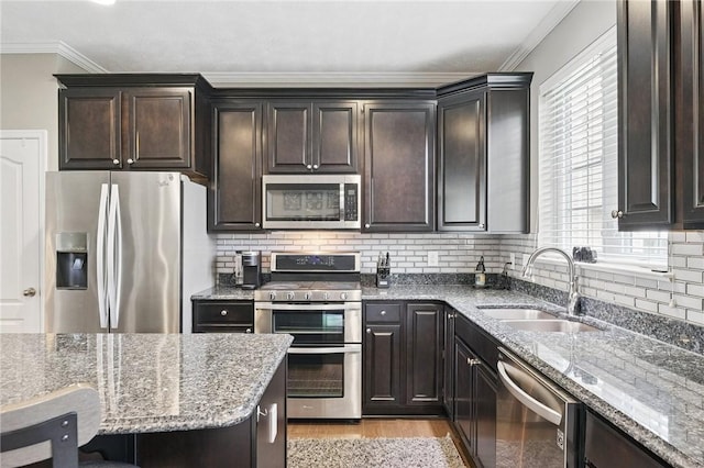 228 Eagle Dr, Cranberry Twp, PA 16066 - kitchen featuring stainless steel appliances, a sink, crown molding, stone countertops, and healthy amount of natural light