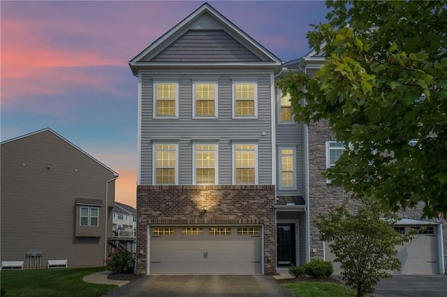 228 Eagle Dr, Cranberry Twp, PA 16066 - townhome / multi-family property with an attached garage, asphalt driveway, and brick siding