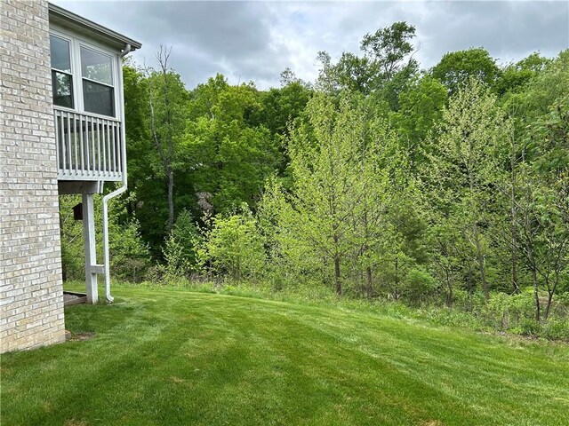 607 Crestview Ln, Lower Burrell, PA 15068 - view of green lawn with a wooded view
