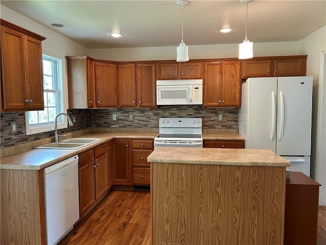607 Crestview Ln, Lower Burrell, PA 15068 - kitchen with white appliances, a sink, wood finished floors, a center island, and recessed lighting