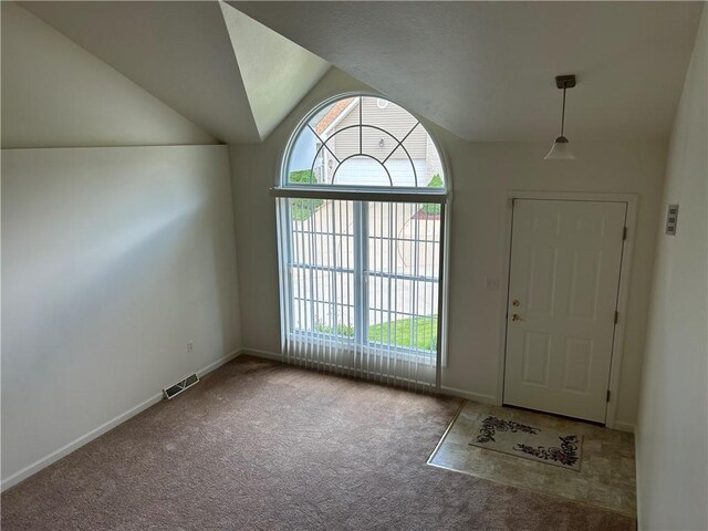 607 Crestview Ln, Lower Burrell, PA 15068 - carpeted foyer entrance with healthy amount of natural light, vaulted ceiling, and baseboards
