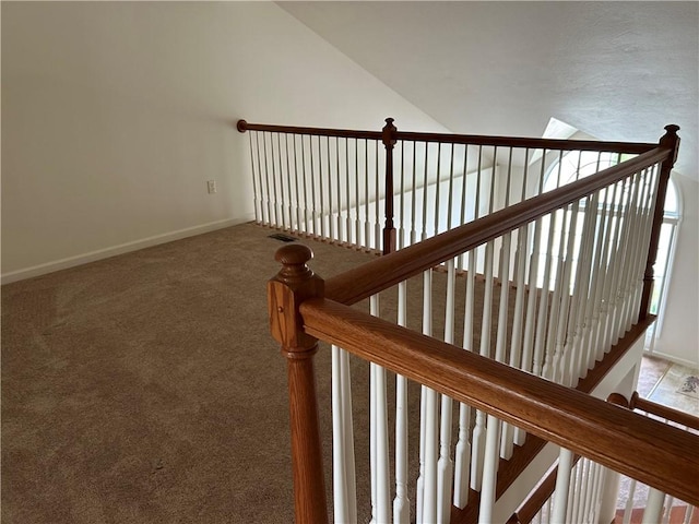 607 Crestview Ln, Lower Burrell, PA 15068 - staircase featuring lofted ceiling, baseboards, and carpet floors