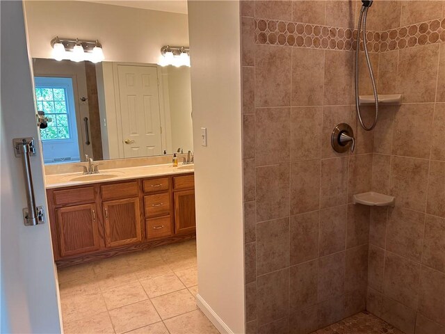 607 Crestview Ln, Lower Burrell, PA 15068 - bathroom featuring double vanity, tiled shower, and tile patterned flooring