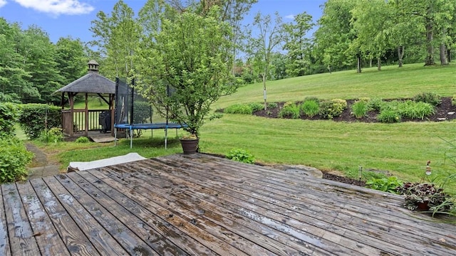 201 Clarke Rd, Buffalo Twp Wsh, PA 15323 - deck featuring a gazebo, a trampoline, a lawn, and view of wooded area