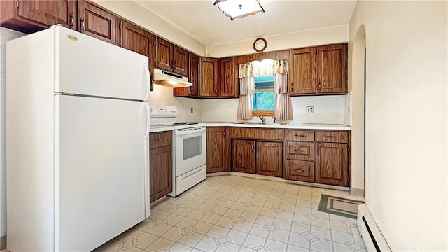 131 E Fairmont Ave, New Castle/2Nd, PA 16105 - kitchen with white appliances, under cabinet range hood, light countertops, brown cabinets, and baseboard heating