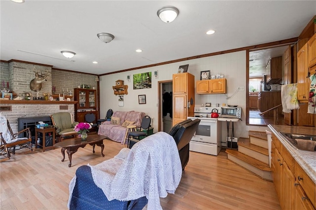 500 Kinsman Rd, Green Twp, PA 16134 - living area featuring light wood-style flooring, crown molding, a brick fireplace, stairs, and recessed lighting