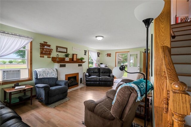 500 Kinsman Rd, Green Twp, PA 16134 - living area with stairway, light wood finished floors, and a fireplace