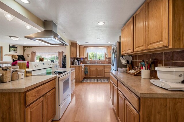 500 Kinsman Rd, Green Twp, PA 16134 - kitchen with electric stove, wall chimney exhaust hood, brown cabinets, and recessed lighting