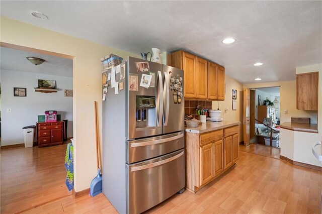 500 Kinsman Rd, Green Twp, PA 16134 - kitchen with stainless steel fridge with ice dispenser, light wood-style floors, recessed lighting, brown cabinets, and light countertops