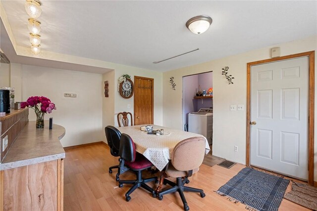 500 Kinsman Rd, Green Twp, PA 16134 - dining room featuring washer / clothes dryer and light wood finished floors