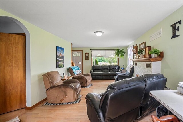 500 Kinsman Rd, Green Twp, PA 16134 - living area with light wood finished floors, arched walkways, and a fireplace