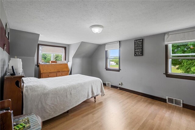 500 Kinsman Rd, Green Twp, PA 16134 - bedroom with wood finished floors, baseboards, and a textured ceiling