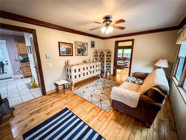 248 Jamisonville Rd, Center Twp But, PA 16001 - living room featuring light wood-style floors, ceiling fan, crown molding, and baseboards
