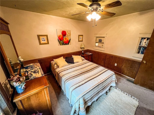 248 Jamisonville Rd, Center Twp But, PA 16001 - bedroom with a wainscoted wall, wood walls, carpet floors, and a ceiling fan
