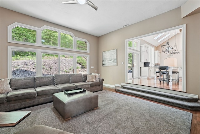 559 Normandy Ct, Fox Chapel, PA 15238 - living area featuring wood finished floors, ceiling fan, baseboards, and vaulted ceiling