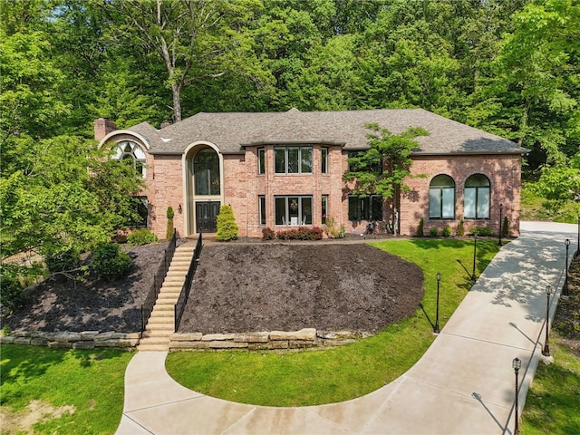 559 Normandy Ct, Fox Chapel, PA 15238 - view of front of home with a front yard, brick siding, and roof with shingles