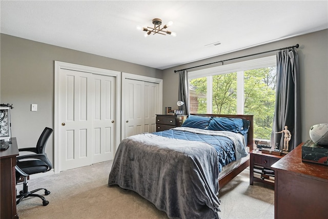 559 Normandy Ct, Fox Chapel, PA 15238 - bedroom featuring light colored carpet, two closets, and an office area
