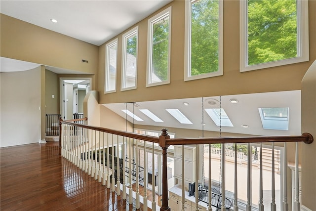 559 Normandy Ct, Fox Chapel, PA 15238 - hall with a skylight, hardwood / wood-style floors, plenty of natural light, a towering ceiling, and baseboards