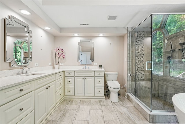 559 Normandy Ct, Fox Chapel, PA 15238 - full bathroom with double vanity, a shower stall, a soaking tub, toilet, and recessed lighting