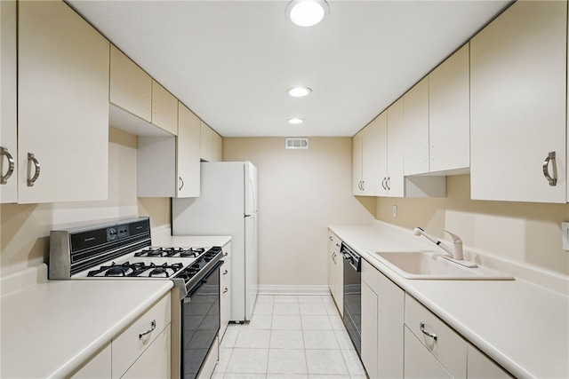 559 Normandy Ct, Fox Chapel, PA 15238 - kitchen featuring range with gas cooktop, a sink, black dishwasher, cream cabinets, and recessed lighting