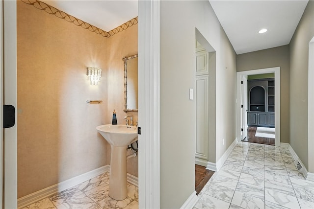 559 Normandy Ct, Fox Chapel, PA 15238 - bathroom with marble look tiles, baseboards, a sink, and recessed lighting