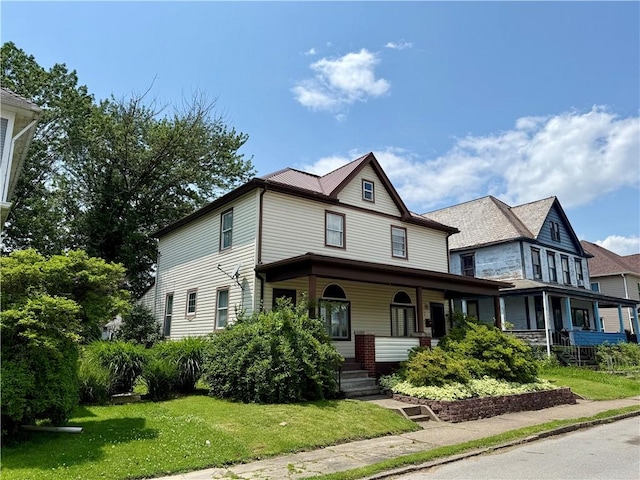 121-123 4th Ave, Scottdale, PA 15683 - view of front facade with a porch and a front yard