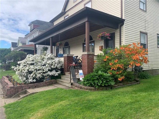 121-123 4th Ave, Scottdale, PA 15683 - view of side of property featuring covered porch and a yard