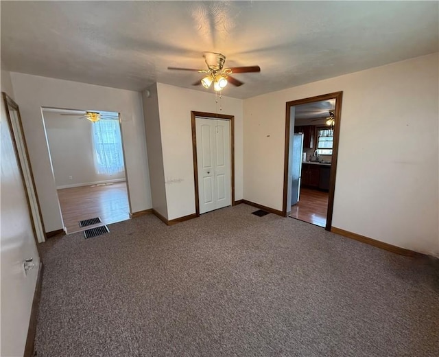121-123 4th Ave, Scottdale, PA 15683 - unfurnished bedroom featuring carpet floors, baseboards, ceiling fan, and a sink