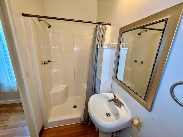 121-123 4th Ave, Scottdale, PA 15683 - bathroom with a sink, wood finished floors, and a shower with shower curtain