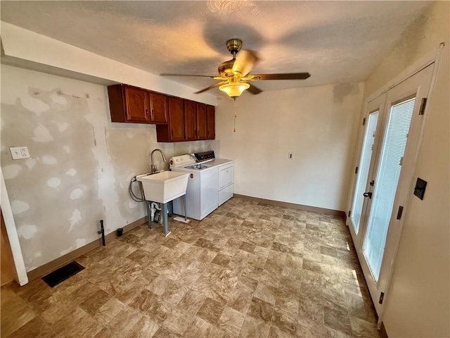 121-123 4th Ave, Scottdale, PA 15683 - laundry room featuring cabinet space, independent washer and dryer, stone finish floors, baseboards, and a ceiling fan