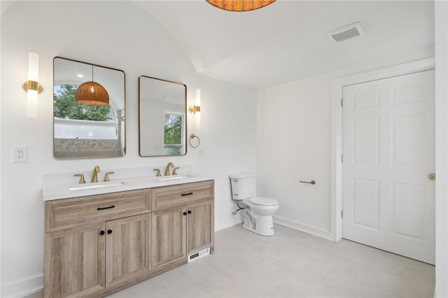 10 Neptune Dr, Robinson Twp Nwa, PA 15136 - bathroom featuring double vanity and lofted ceiling