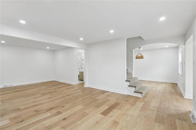 10 Neptune Dr, Robinson Twp Nwa, PA 15136 - below grade area featuring stairway, light wood-type flooring, arched walkways, and recessed lighting