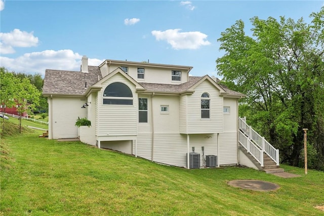 10 Neptune Dr, Robinson Twp Nwa, PA 15136 - back of property with a yard, a shingled roof, stairs, and a chimney