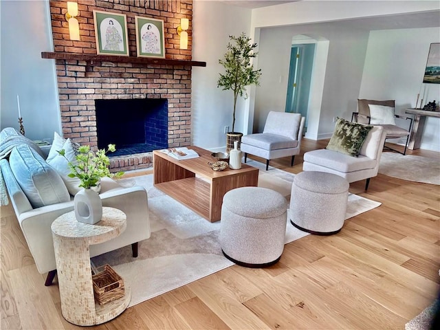 10 Neptune Dr, Robinson Twp Nwa, PA 15136 - living area with wood finished floors, a fireplace, and arched walkways