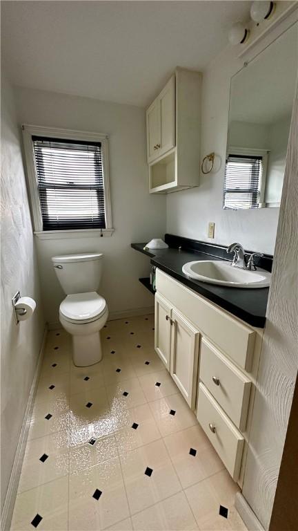 820-822 Main St, Springdale Twp, PA 15049 - bathroom with vanity, toilet, and tile patterned flooring