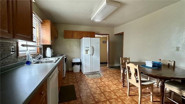 820-822 Main St, Springdale Twp, PA 15049 - kitchen featuring white refrigerator with ice dispenser, dishwasher, a sink, electric range, and decorative backsplash
