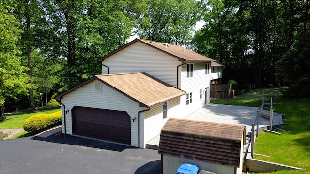 452 Cherokee Dr, Center Twp But, PA 16001 - view of front of home featuring a garage, a front yard, and roof with shingles