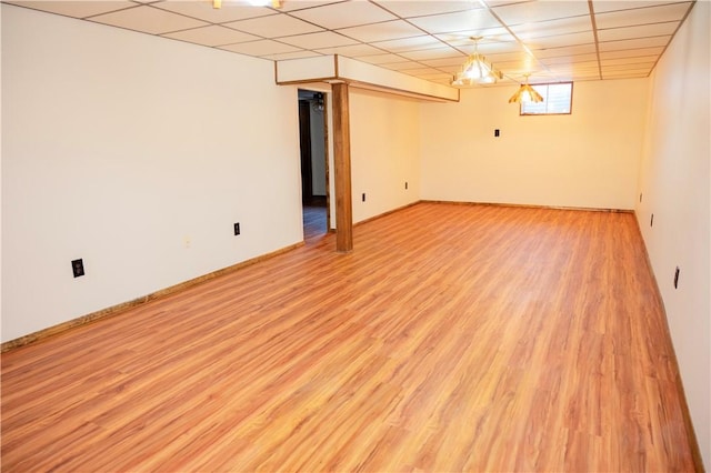 452 Cherokee Dr, Center Twp But, PA 16001 - basement with light wood-style flooring, a drop ceiling, and baseboards