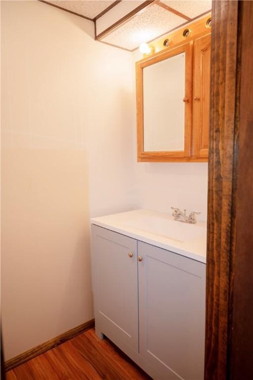 452 Cherokee Dr, Center Twp But, PA 16001 - bathroom with vanity, wood finished floors, and baseboards