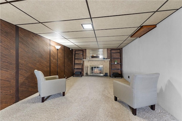404 Neola Cir, Ross Twp, PA 15237 - living area with carpet floors, wooden walls, a fireplace, and a drop ceiling