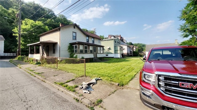 58 Elm St, Natrona Hts/Harrison Twp, PA 15065 - view of side of property featuring a yard and a residential view
