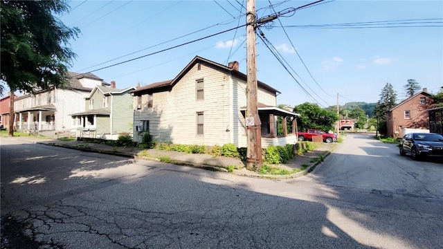 58 Elm St, Natrona Hts/Harrison Twp, PA 15065 - view of side of property featuring a chimney and a residential view
