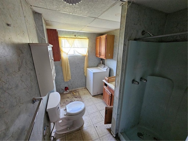 58 Elm St, Natrona Hts/Harrison Twp, PA 15065 - full bath with washer / dryer, a stall shower, tile patterned floors, toilet, and a paneled ceiling