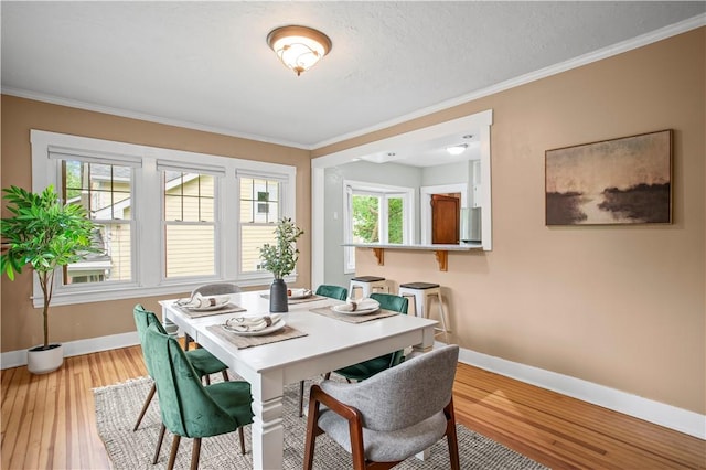 203 W Hutchinson Ave, Regent Square, PA 15218 - dining area featuring ornamental molding and light wood-style floors