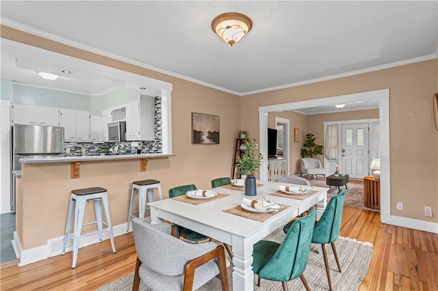 203 W Hutchinson Ave, Regent Square, PA 15218 - dining area with light wood finished floors and ornamental molding